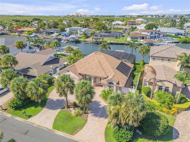 drone / aerial view with a water view and a residential view