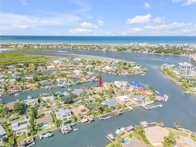drone / aerial view with a water view and a residential view