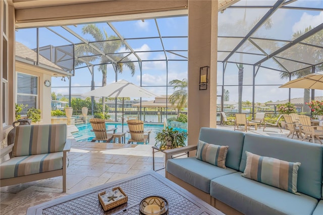 sunroom featuring an outdoor living space, outdoor dining space, and a wealth of natural light