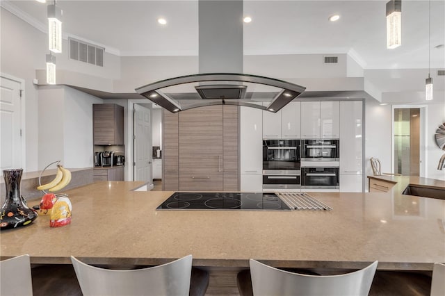kitchen featuring ornamental molding, visible vents, black electric stovetop, and island range hood