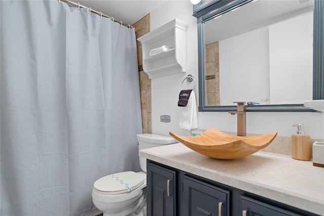 full bathroom with toilet and vanity