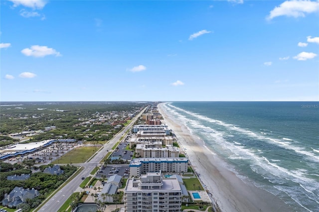drone / aerial view featuring a view of the beach and a water view