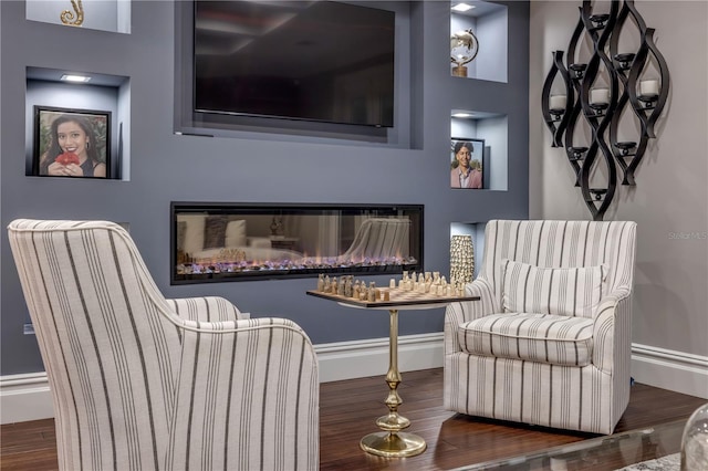 6771 Turtlemound Rd, New Smyrna Beach, FL 32169 - living area with baseboards and wood finished floors