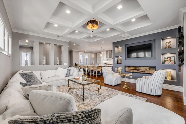 6771 Turtlemound Rd, New Smyrna Beach, FL 32169 - living area with coffered ceiling, a wealth of natural light, dark wood-type flooring, and beam ceiling