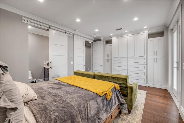 6771 Turtlemound Rd, New Smyrna Beach, FL 32169 - bedroom with a closet, recessed lighting, a barn door, dark wood finished floors, and crown molding