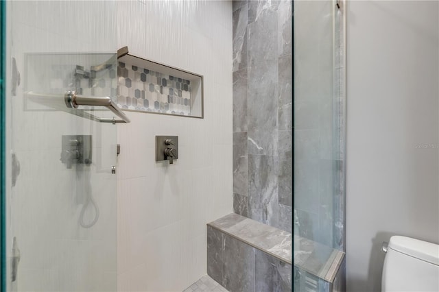 6771 Turtlemound Rd, New Smyrna Beach, FL 32169 - bathroom featuring toilet and tiled shower