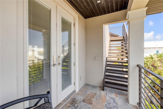 6771 Turtlemound Rd, New Smyrna Beach, FL 32169 - balcony featuring stairs and french doors