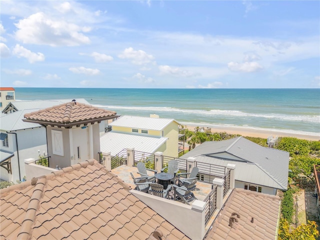 6771 Turtlemound Rd, New Smyrna Beach, FL 32169 - water view with an outdoor fire pit and a view of the beach