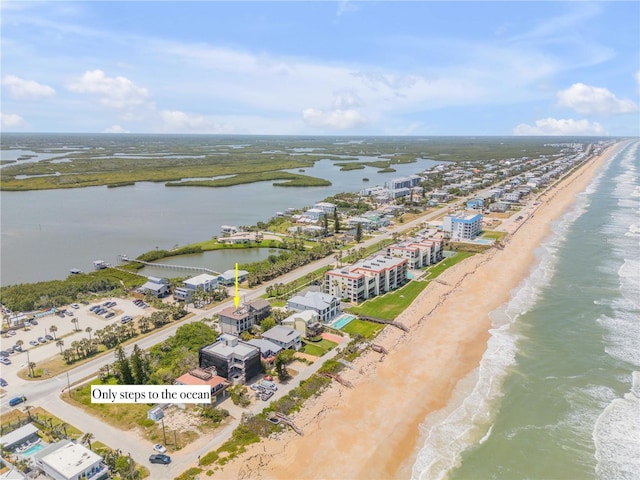 6771 Turtlemound Rd, New Smyrna Beach, FL 32169 - bird's eye view featuring a water view and a view of the beach