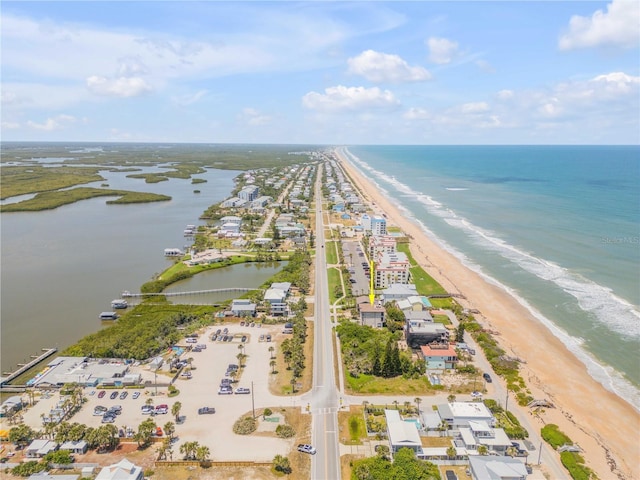 6771 Turtlemound Rd, New Smyrna Beach, FL 32169 - bird's eye view featuring a water view and a beach view