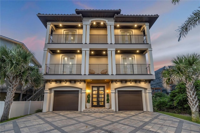 6771 Turtlemound Rd, New Smyrna Beach, FL 32169 - mediterranean / spanish house with stucco siding, french doors, and a balcony