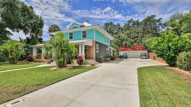 508 Faulkner St, New Smyrna Beach, FL 32168 - traditional style home with an outbuilding, a front yard, driveway, a chimney, and a detached garage