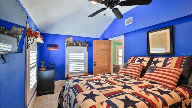 508 Faulkner St, New Smyrna Beach, FL 32168 - carpeted bedroom featuring lofted ceiling, multiple windows, ceiling fan, and baseboards