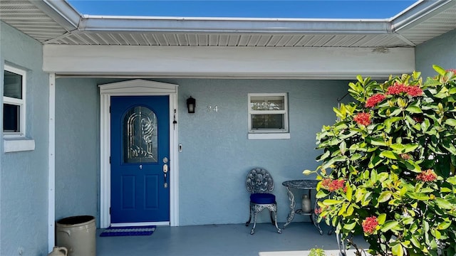 34 Richmond Dr, New Smyrna Beach, FL 32169 - property entrance with stucco siding