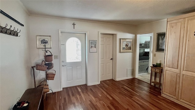 34 Richmond Dr, New Smyrna Beach, FL 32169 - entrance foyer featuring baseboards, visible vents, crown molding, and dark wood-style floors