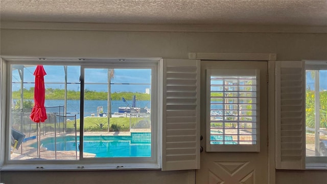 34 Richmond Dr, New Smyrna Beach, FL 32169 - entryway featuring a textured ceiling and a water view