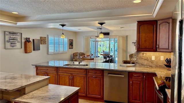 34 Richmond Dr, New Smyrna Beach, FL 32169 - kitchen with a peninsula, stainless steel appliances, a raised ceiling, and a sink
