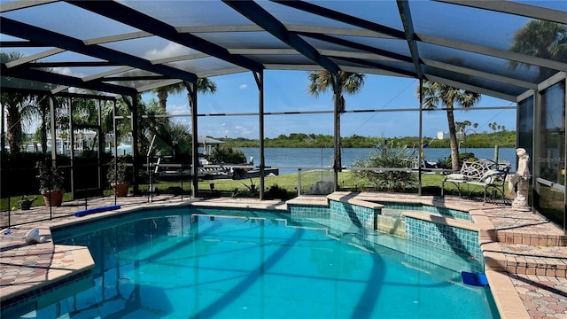 34 Richmond Dr, New Smyrna Beach, FL 32169 - view of swimming pool with a pool with connected hot tub, a patio, a water view, and glass enclosure