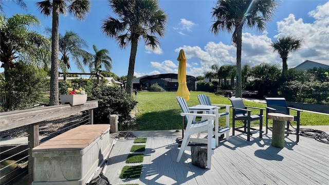 34 Richmond Dr, New Smyrna Beach, FL 32169 - wooden terrace featuring a lawn