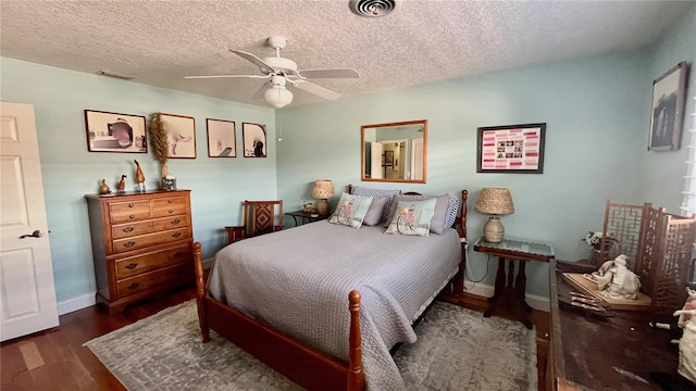 34 Richmond Dr, New Smyrna Beach, FL 32169 - bedroom with a textured ceiling, visible vents, wood finished floors, and baseboards