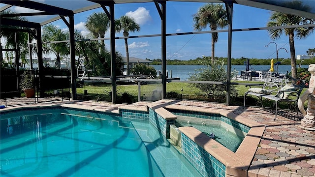 34 Richmond Dr, New Smyrna Beach, FL 32169 - view of pool featuring a pool with connected hot tub, a lanai, a water view, and a patio area