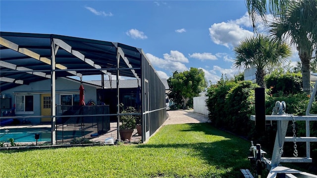 34 Richmond Dr, New Smyrna Beach, FL 32169 - view of yard featuring a patio area, fence, an outdoor pool, and glass enclosure