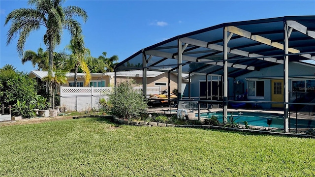 34 Richmond Dr, New Smyrna Beach, FL 32169 - outdoor pool with a patio, fence, a lawn, and glass enclosure