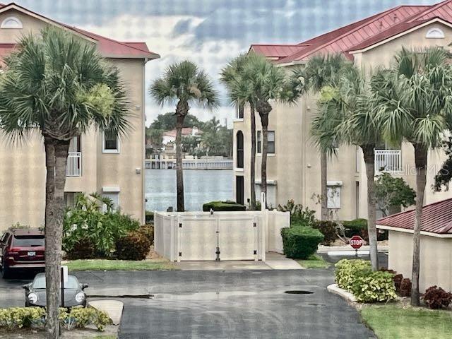 439 Bouchelle Dr Unit 202, New Smyrna Beach, FL 32169 - view of street featuring a gate