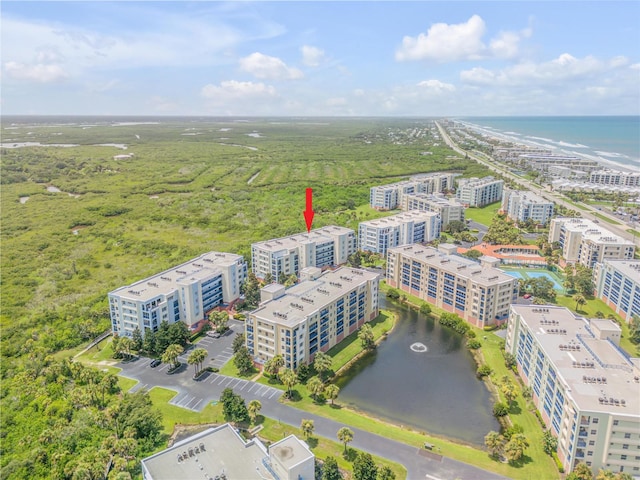 bird's eye view of a nearby body of water and apartment complex
