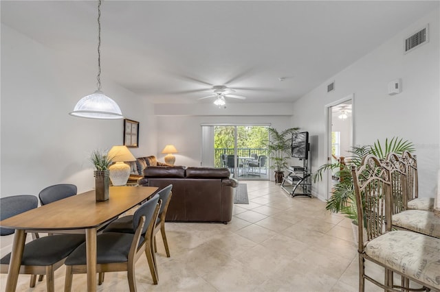 dining area featuring a ceiling fan and light tile patterned floors