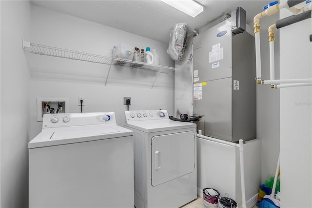 clothes washing area featuring separate washer and dryer