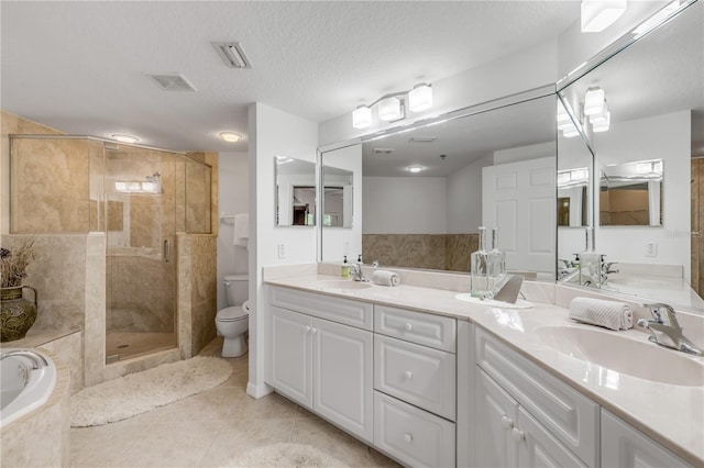 bathroom featuring toilet, a shower stall, a bath, tile patterned floors, and double vanity