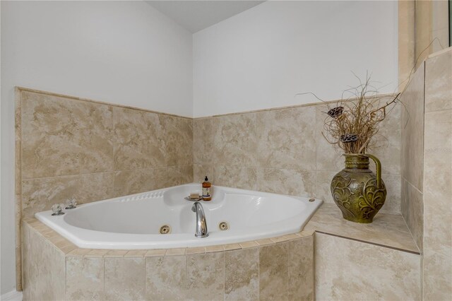 bathroom with a whirlpool tub