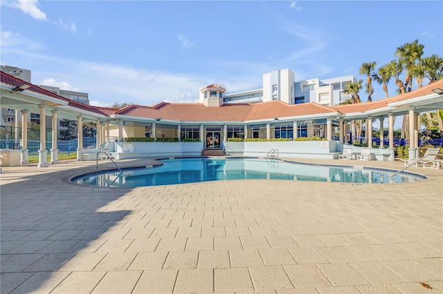 community pool featuring a patio area