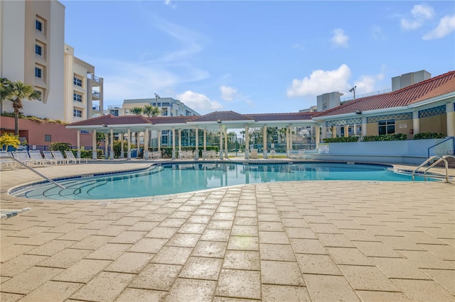community pool featuring a patio area