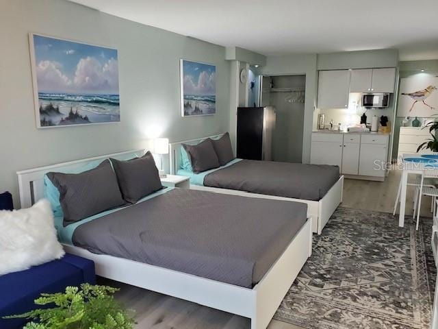 bedroom with wood finished floors