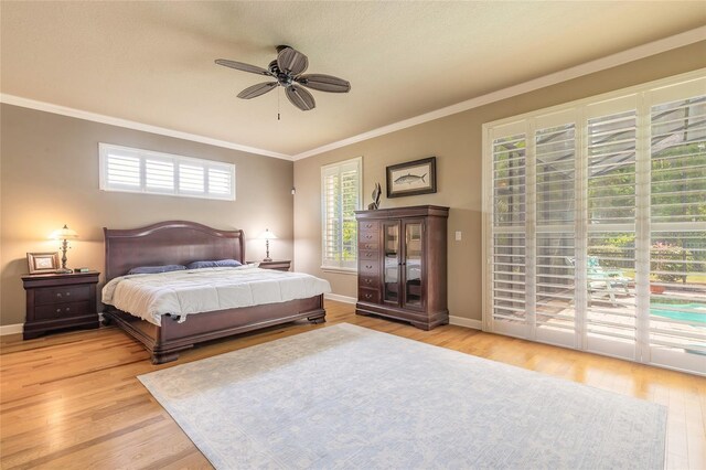 bedroom with ornamental molding, access to outside, baseboards, and light wood-style floors