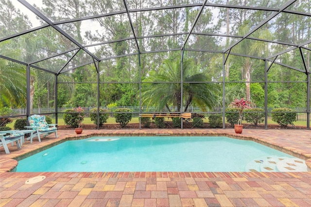 pool with a patio and a lanai
