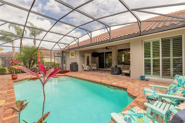outdoor pool featuring a patio area and a ceiling fan