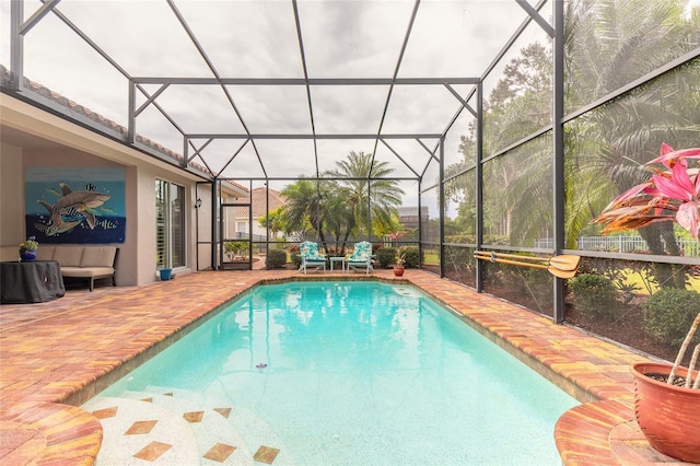 pool featuring a lanai and a patio