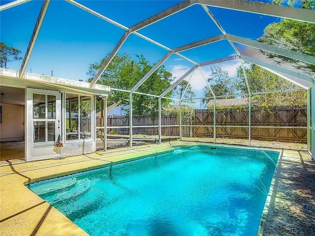 view of pool with a patio, a fenced in pool, a lanai, and a fenced backyard