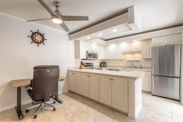 kitchen featuring stainless steel appliances, a sink, light countertops, crown molding, and a peninsula
