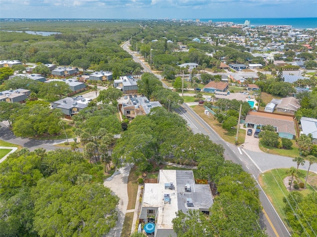 aerial overview of property's location featuring a nearby body of water