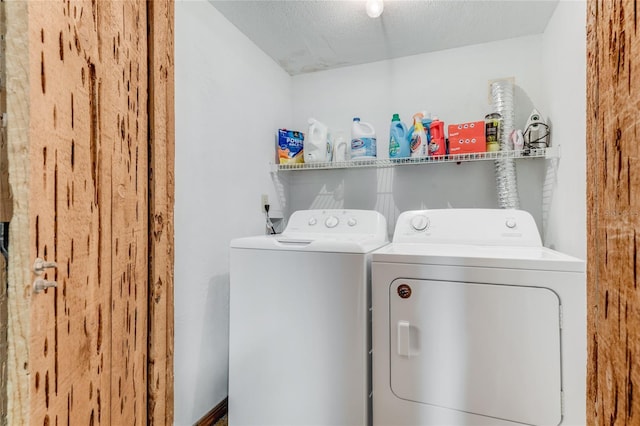 laundry area featuring laundry area and washer and clothes dryer