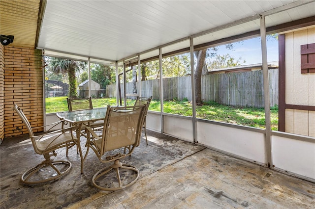 sunroom with outdoor dining space