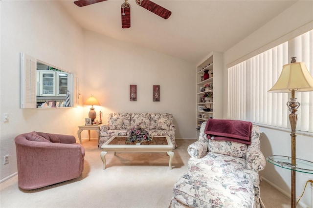 carpeted living room featuring ceiling fan, vaulted ceiling, and baseboards