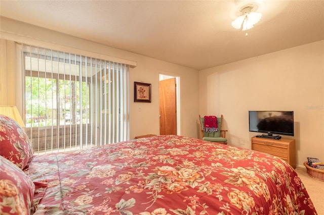 carpeted bedroom featuring access to outside