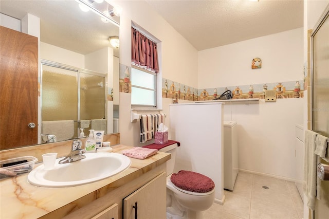 bathroom featuring a shower stall, tile patterned flooring, vanity, toilet, and a textured ceiling