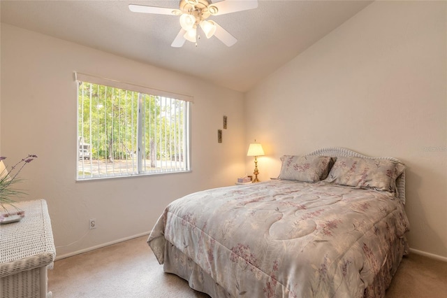 bedroom with carpet floors, baseboards, lofted ceiling, and ceiling fan
