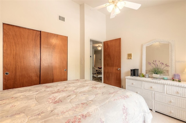 bedroom featuring a closet and a towering ceiling